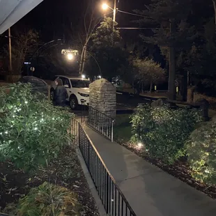 a car parked on the side of the road at night