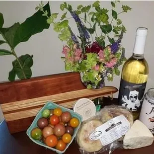 Wine, cheese, heirloom tomatoes, handmade cutting board - what a great house warming gift from the farmer's market!