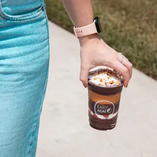 a person holding a cup of coffee