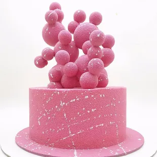 Custom cake. Vanilla berry sponge cake, decorated with chocolate velvet and chocolate bubbles.