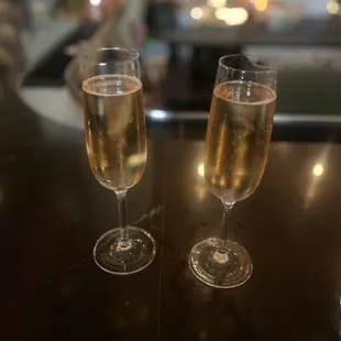 two glasses of wine on a table