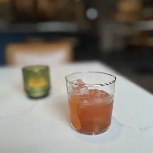 a drink in a glass on a table