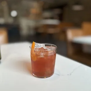 a drink in a glass on a table