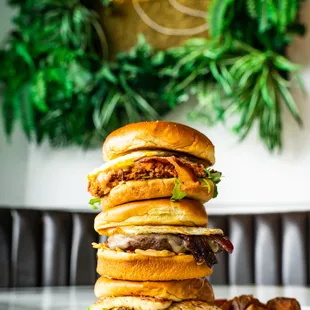 a stack of burgers on a plate
