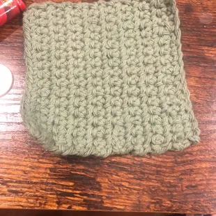 a crochet purse on a table