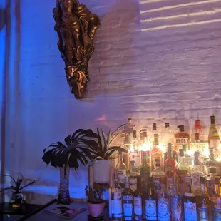 a bar with bottles of alcohol