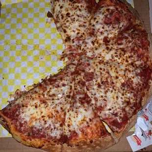 a half eaten pizza in a box