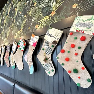  christmas stockings hung on a wall