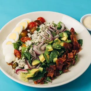 Cobb Salad - avocado, cherry tomato, bleu cheese crumble, red onion, bacon, hard-boiled egg, bleu cheese dressing
 [veg &amp; GF]