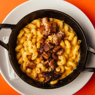 Mac &amp; Queso topped with pork belly.