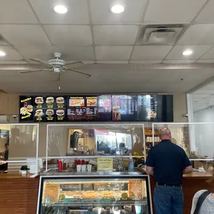 a man and a woman ordering food