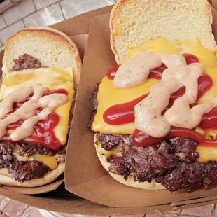 Two Double Burgers Topped with Wild Sauce &amp; Ketchup!