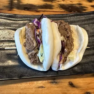 Beef brisket Bao buns with pickles on side