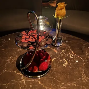 a plate of strawberries and a glass of champagne