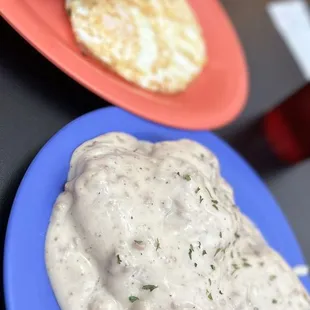 Biscuits and gravy, eggs, over medium and fried apples