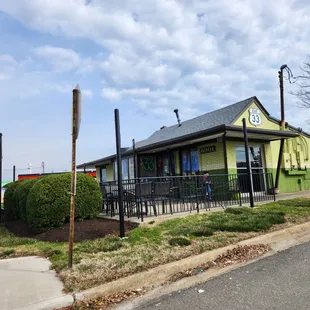 a restaurant with a green exterior