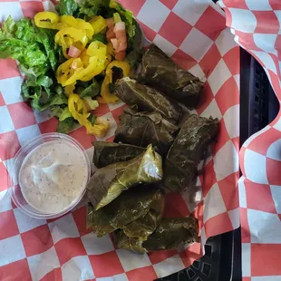 Grape leaves with a little salad and Tzaziki sauce