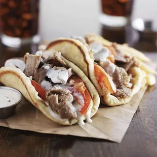 a pita sandwich with meat and vegetables