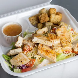a chicken salad in a styrofoam container