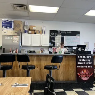 a restaurant with a checkered floor