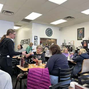 a group of people sitting at tables