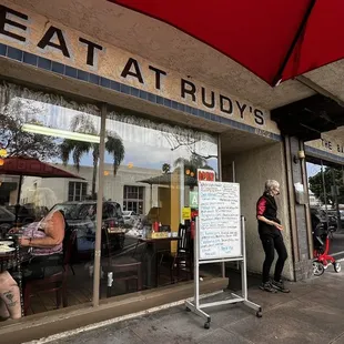 people eating outside a restaurant