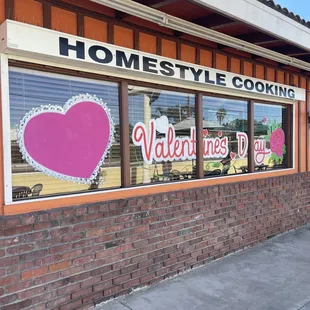 The owner hired a painter to decorate the windows.