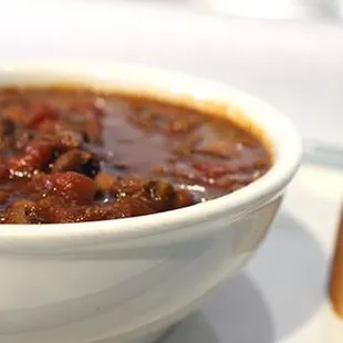 a bowl of chili and bread