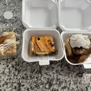 Left to right: Apple pie(?) cheese bar, pumpkin chocolate chip cheesecake bar, cinnamon roll that wasn&apos;t heated up yet.