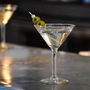 two martinis on a bar