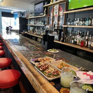 Jalapeño margarita  Pineapple margarita  Poke tostadas  Buffalo chicken egg rolls  Shrimp and pork egg rolls