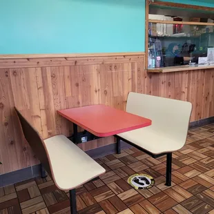 a table and two chairs in a restaurant