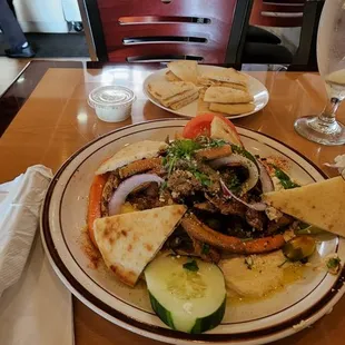 Chicken shawarma on hummus