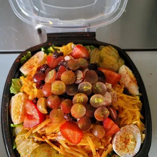 a salad in a plastic container