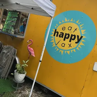 a food truck with a sign that says eat happy box