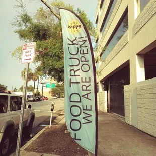 a sign on the side of a street