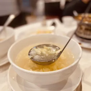 a bowl of soup with a spoon in it