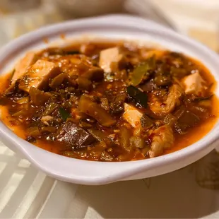 a bowl of soup on a table