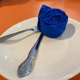 Napkin wrapped as a flower! Love the cute touches here!