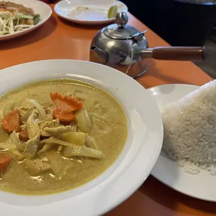 Yellow curry with chicken, potatoes, onions and delicate carrots