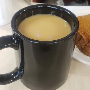 a cup of coffee and a sandwich