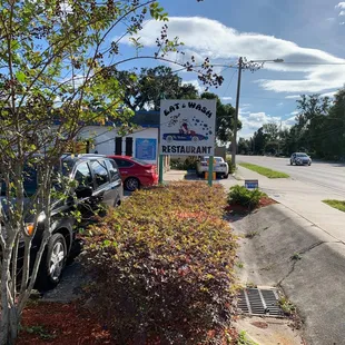 a truck parked in front of a restaurant