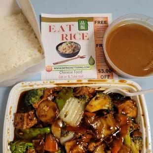 a bowl of broccoli and a container of rice
