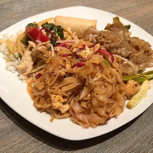 My plate sampling. Pad Thai in the foreground, pad see ew on the right, yellow curry on the left, egg roll in the background.