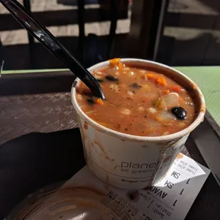 a cup of soup on a table