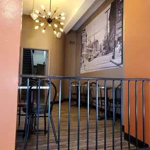 a view of a dining room from the balcony