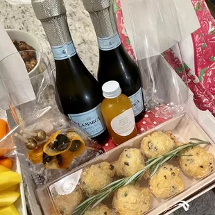 Cocktail set came with champagne (2 plastic flutes), cheese puffs, garnish and mixer