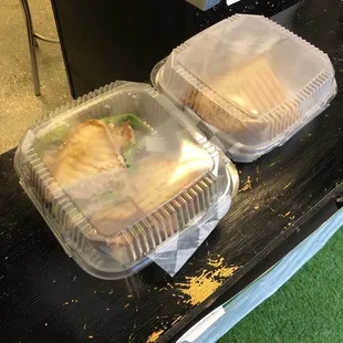 two sandwiches in plastic containers
