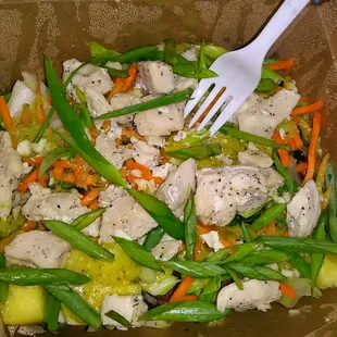 a meal in a box with a fork