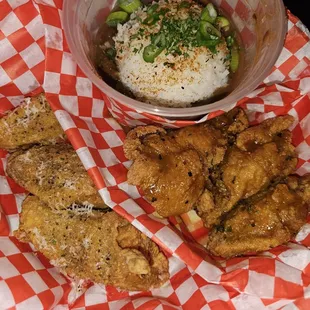 Parmesan and gold sauce wings with a side of red beans and rice.